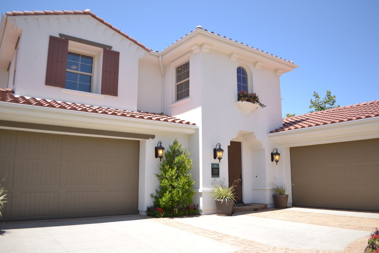 who-we-are Bright suburban home with classic architecture and landscaped garden, ideal for real estate listings.