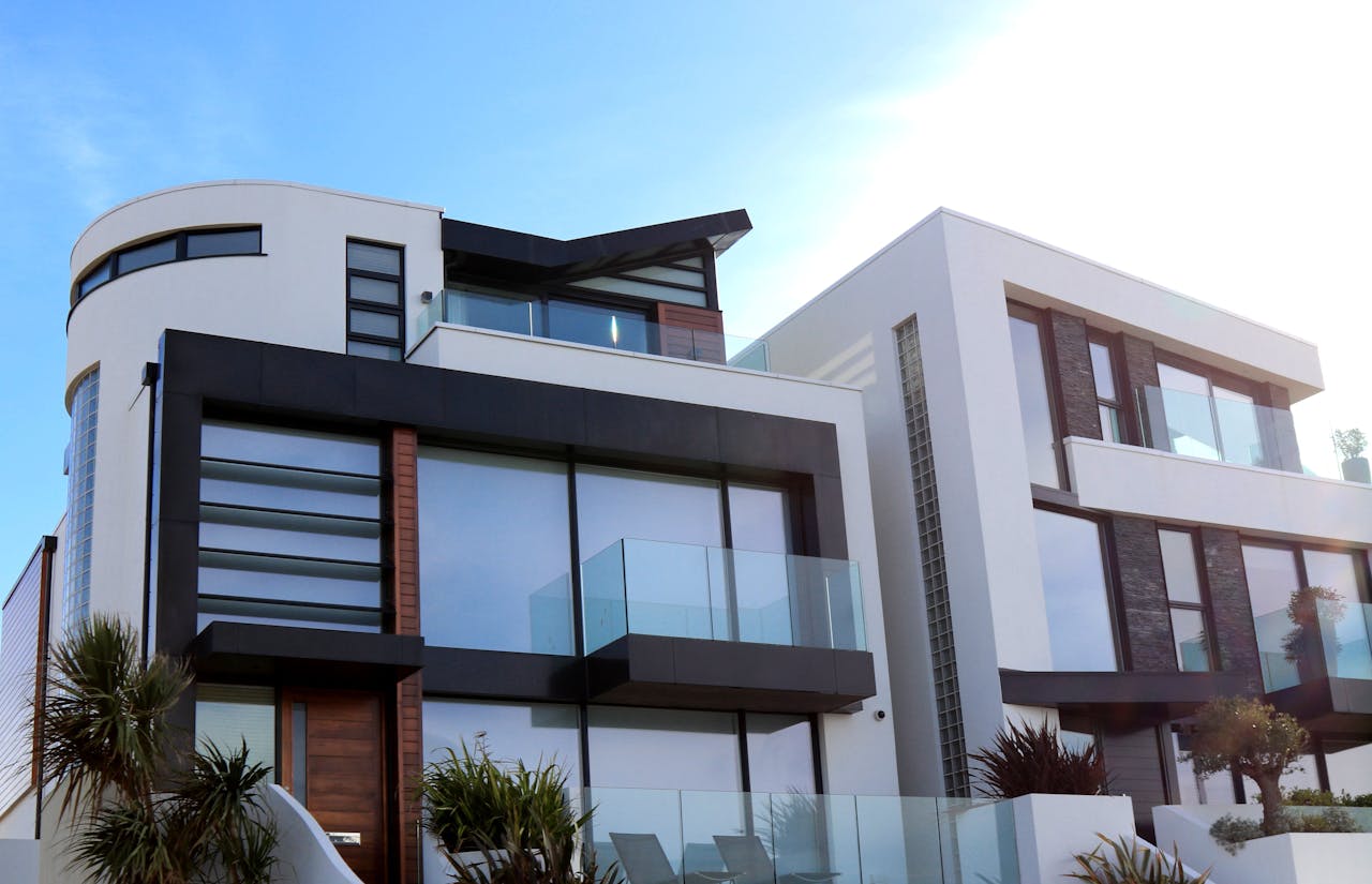 services-01 Contemporary luxury home with glass balconies in Poole, UK, showcasing modern architectural design.