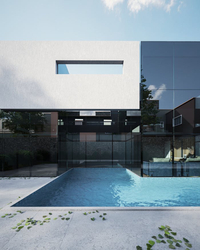 services-03 3D rendered image of a modern minimalist house with a swimming pool in a bright outdoor setting.